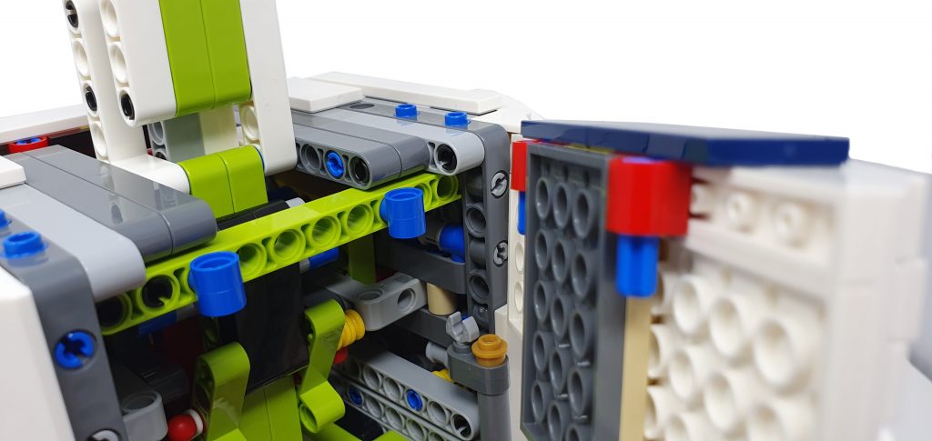 picture showing the first part of connecting the panel to the body of the lego r2d2 set